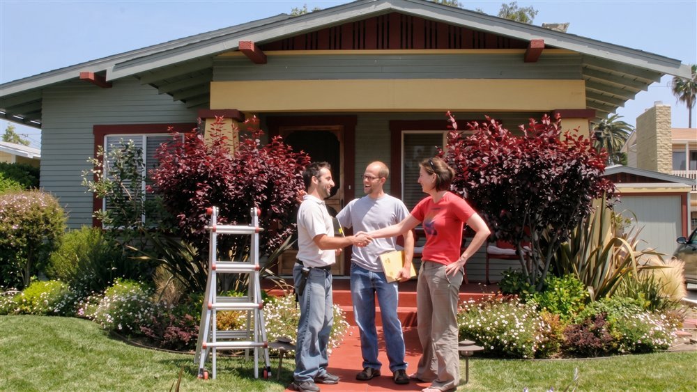 Inspector walking a buyer through the house