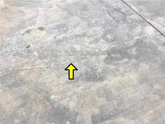 Inspection photo: driveway settling crack